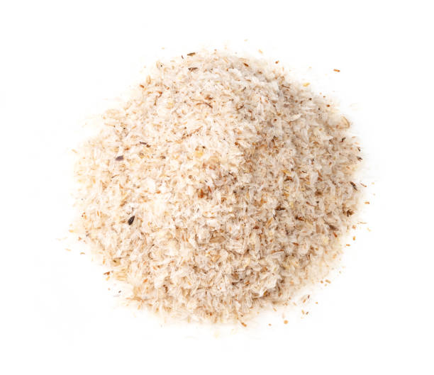handful of Psyllium husk closeup on white