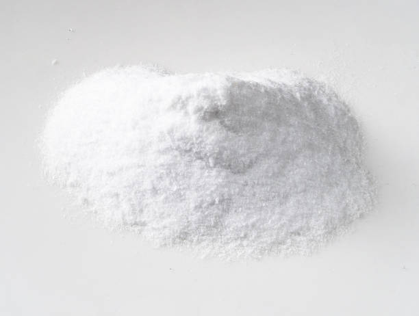 pile of dextrose crystalline sugar on white