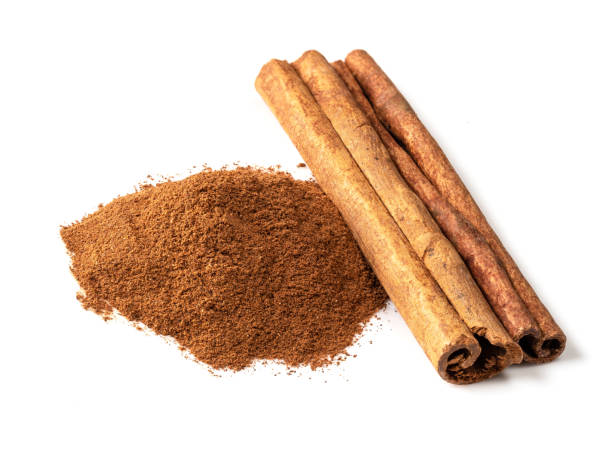 istock handful of cinnamon stick and powder on white 1320294015