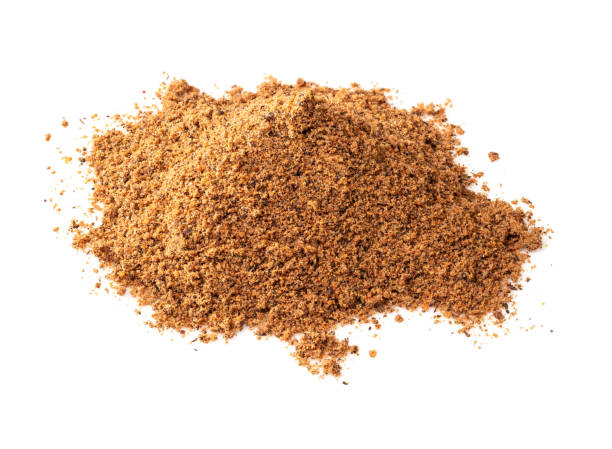 istock handful of nutmeg powder closeup on white 1320294021