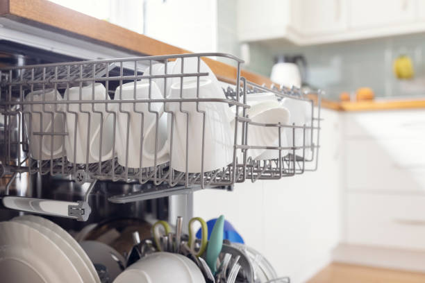 istock Dishwasher with clean dishes in home kitchen 1320295635