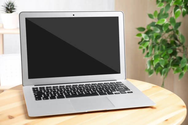 istock Modern laptop on wooden table indoors. Comfortable workplace 1320295770