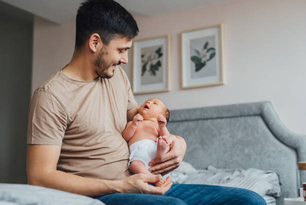 istock Unrecognizable Father Bonding With Newborn 1320296507
