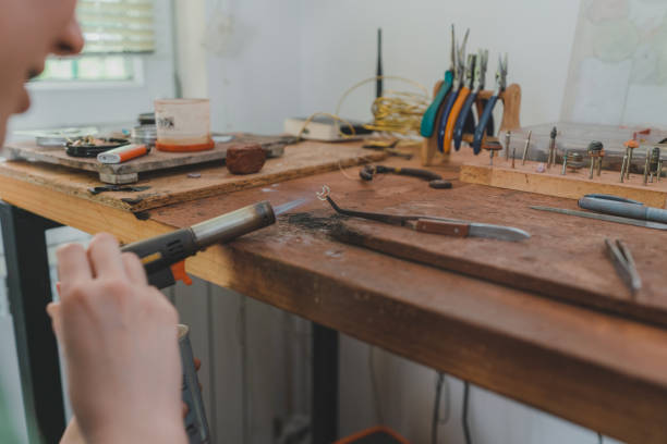 istock Woman making jewelry at her studio 1320297848