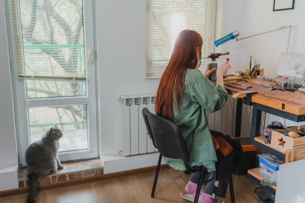 istock Woman making jewelry at her studio 1320297881