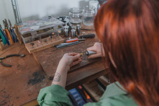 istock Woman making jewelry at her studio 1320297959
