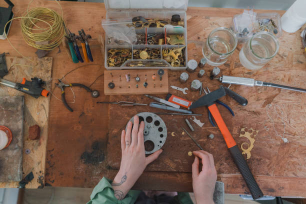 istock Woman making jewelry at her studio 1320297976