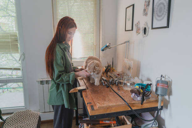 istock Woman making jewelry at her studio 1320298014