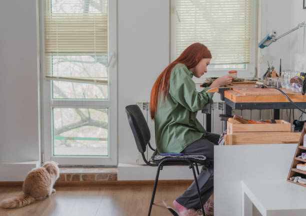istock Woman making jewelry at her studio at home 1320298018
