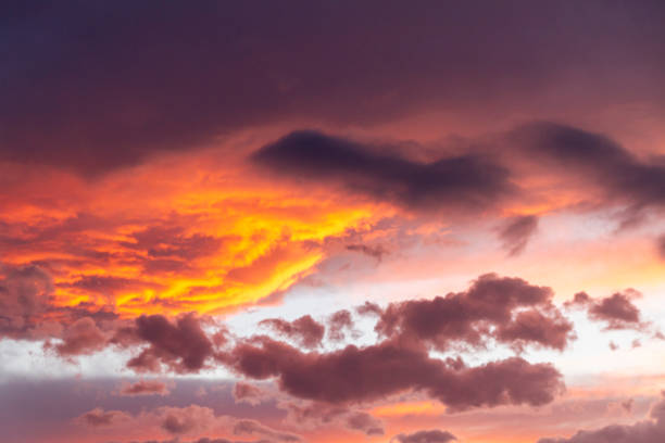 Beautiful bright sunset on mountains with storm clouds stock photo