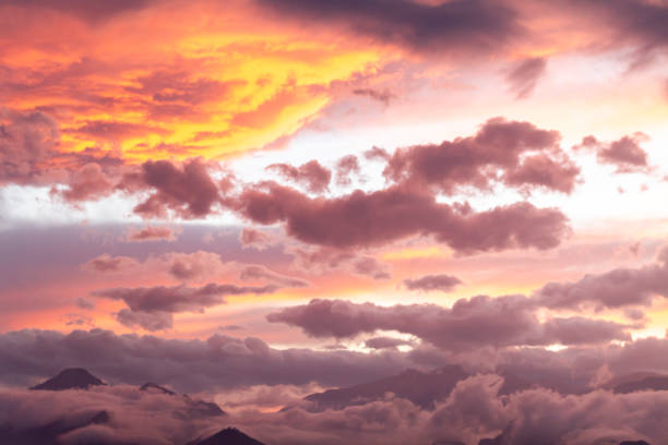 Beautiful bright sunset on mountains with storm clouds stock photo