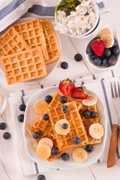 istock Waffles with blueberries, bananas and honey. 1320299153