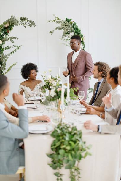 istock Groom giving a toast and speech at a wedding reception 1320299596