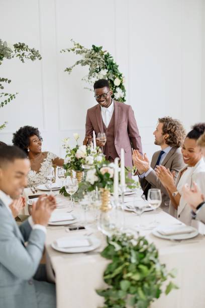 istock Groom giving a toast and speech at a wedding reception 1320299598