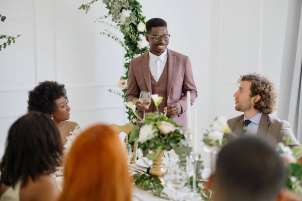 istock Groom giving a toast and speech at a wedding reception 1320299599