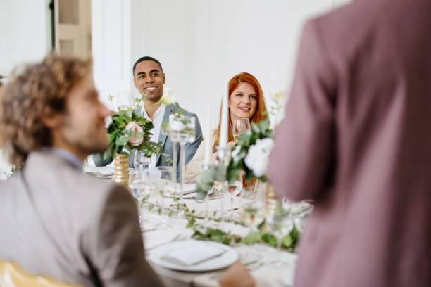 istock Groom giving a toast and speech at a wedding reception 1320299604