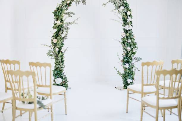 Decorated wedding altar and seating Decorated greenery wedding altar with chairs in the foreground altar stock pictures, royalty-free photos & images