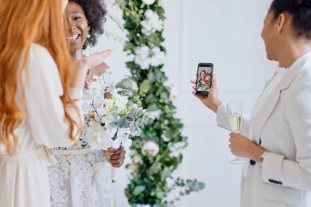 istock Friends on a video call during wedding reception 1320300210