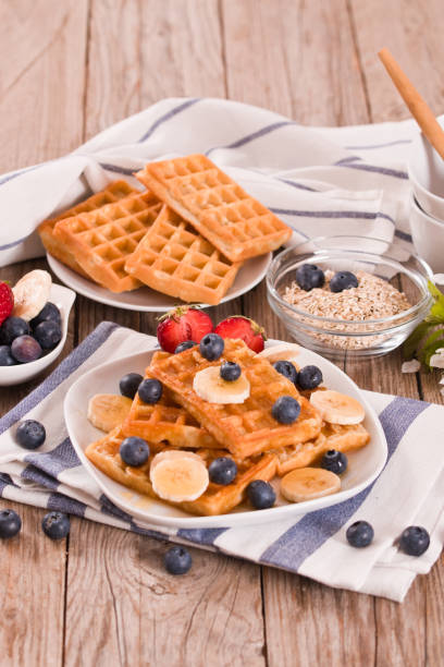 istock Waffles with blueberries, bananas and honey. 1320300262