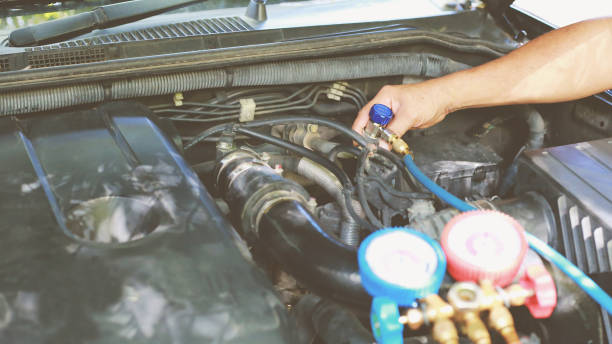 istock Car air conditioner check service, leak detection, fill refrigerant.Device and meter liquid cooling in the car by specialist technicians. 1320300794