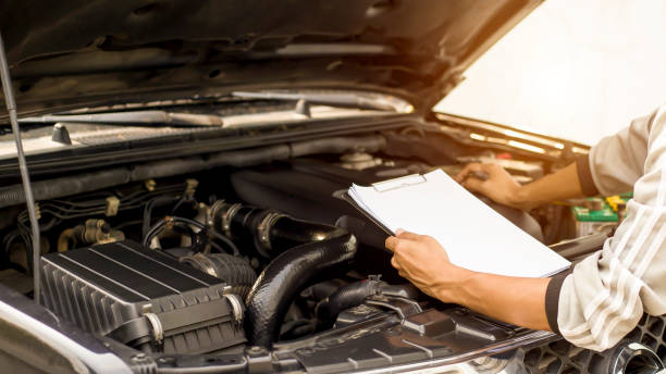 istock A technician is checking the car battery for availability.; 1320301065