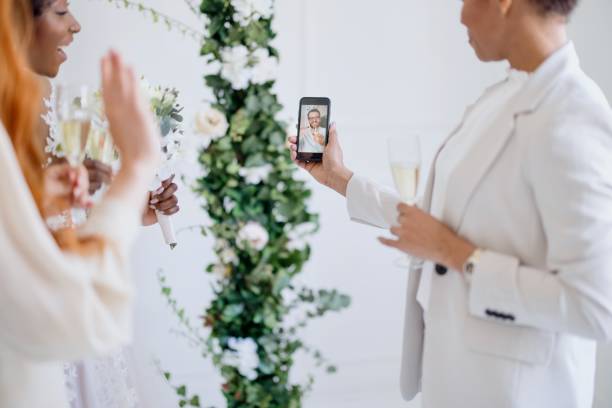 istock Bride talking to her friend via video call 1320301104
