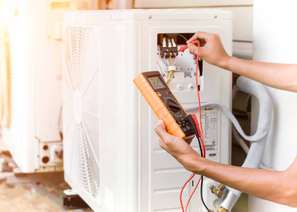 istock Air conditioner repairman using electricity meter to check air conditioner operation, maintenance concept 1320301153