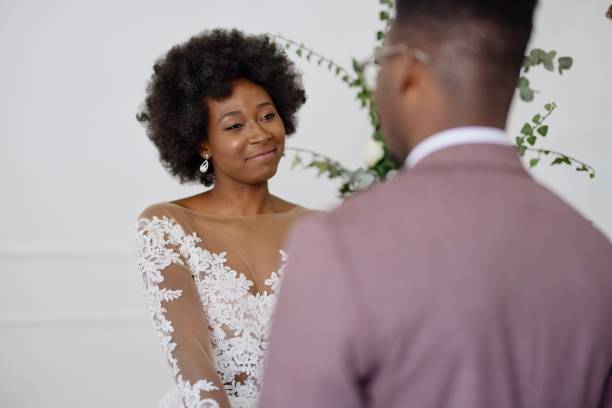 istock Bride and groom exchanging wedding vows 1320301165