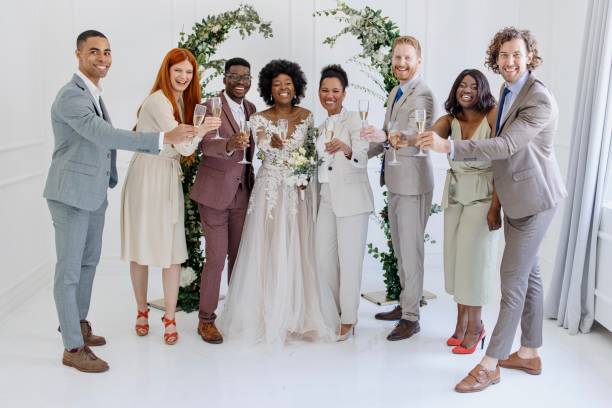 istock Newlyweds toasting champagne with guests 1320301252