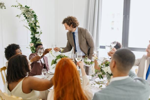 Best man giving a toast and speech at a wedding reception