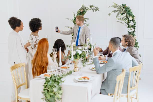 istock Friends on a video call during wedding reception 1320301331
