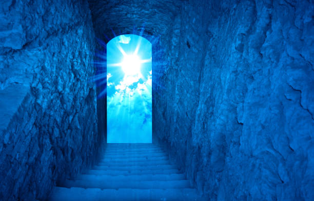 istock Jesus Christ is risen. Exit from the cave, stairs up, sun with rays. Biblical story concept. Easter. 1320302715