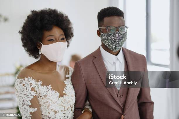 Portrait Of Newlyweds Wearing Face Protective Masks At Their Wedding Due Covid19 Stock Photo - Download Image Now