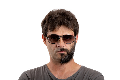 split personality - portrait of ordinary forty - 40 years old bearded man with half shaved and unshaven face with sunglasses isolated on white