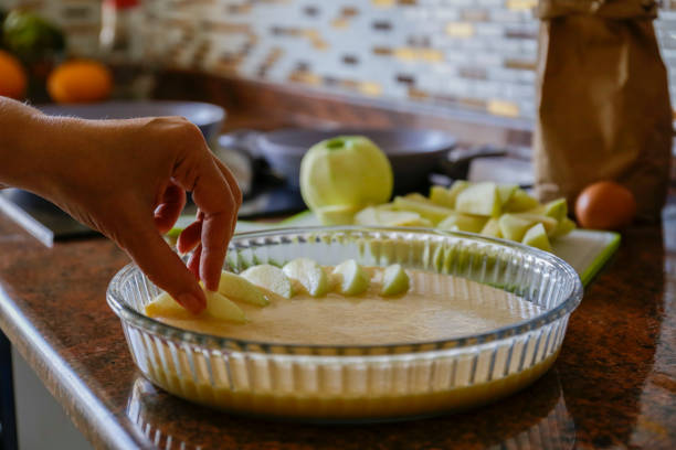 Process of cooking the traditional tart organic with apples and cinnamon and other ingredients on the table. Close up, copy space, top view, background.