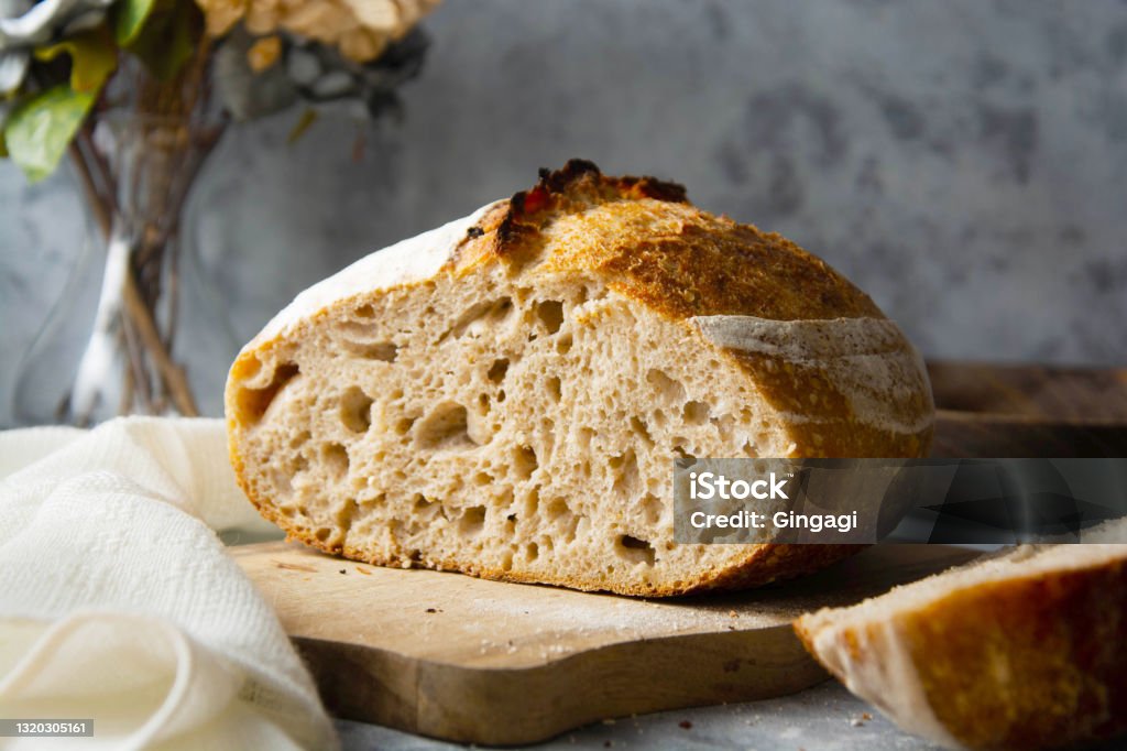 Sourdough bread sliced, made from wild yeast. Cooking healthy foods. Sourdough bread sliced, made from wild yeast. Cooking healthy eating Bread Stock Photo