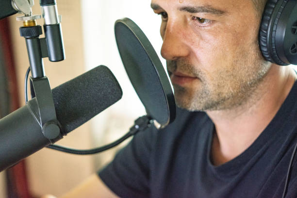 istock Handsome male radio host in studio 1320305212