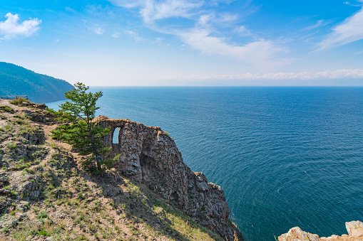 Mountain coast of Lake Baikal on a summer day. Cape Khoboy is the northernmost point of Olkhon Island. Siberia, Russia.