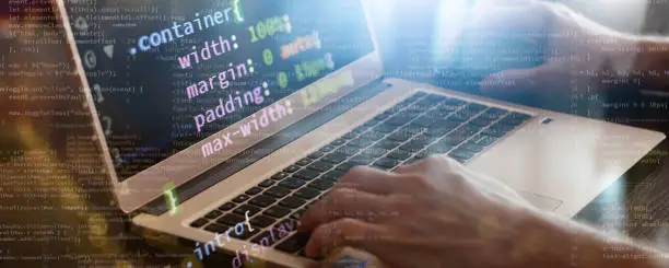 Photo of code writing on laptop banner
