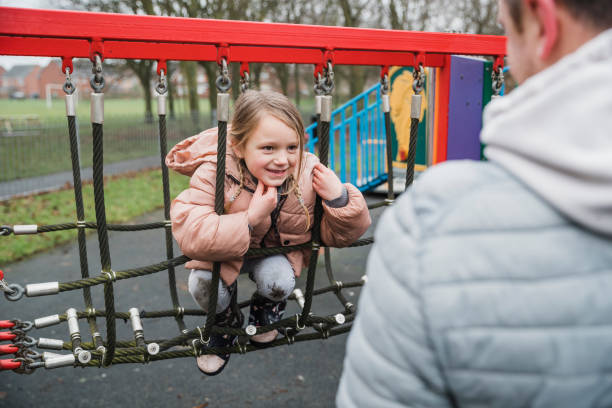 climbing in the playground - child jungle gym playground laughing imagens e fotografias de stock