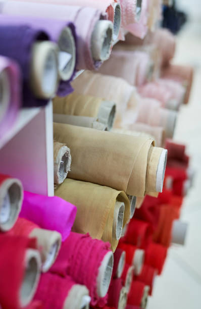 istock Colorful textile linen rolls in drapery. Tailoring concept 1320313641