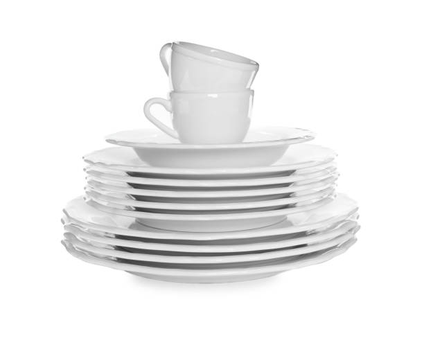 istock Stacked plates and cups on white background 1320314739