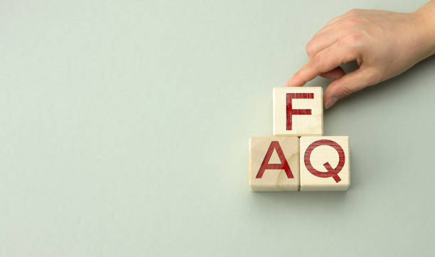istock inscription FAQ (frequently asked questions) on wooden blocks on a gray background. QA concept, help and tips 1320314769