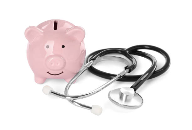 istock Piggy bank and stethoscope on white background 1320315979