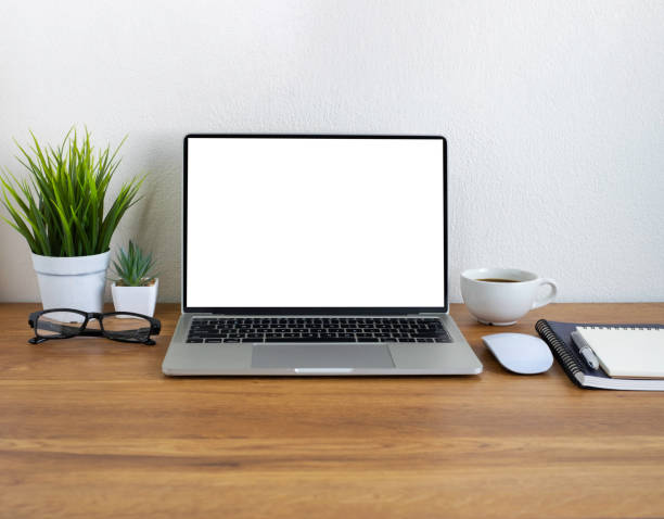 istock Wooden office desk table with keyboard of laptop, coffee cup and notebook, mouse computer with equipment office supplies. Business and finance concept. Workplace, Flat lay with blank copy space. 1320316050