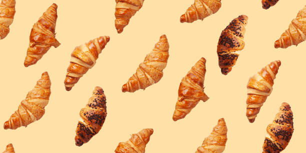 istock Fresh tasty croissants seamless 1320317280