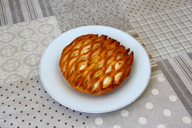 Wicker bun with a cottage cheese on a plate