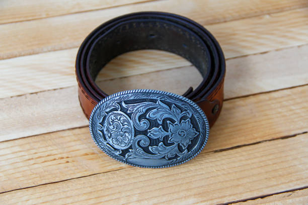 istock Leather cowboy belt on wooden background 1320317347
