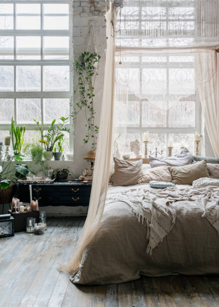 istock Bed with baldachin in Bohemian style bedroom 1320320181