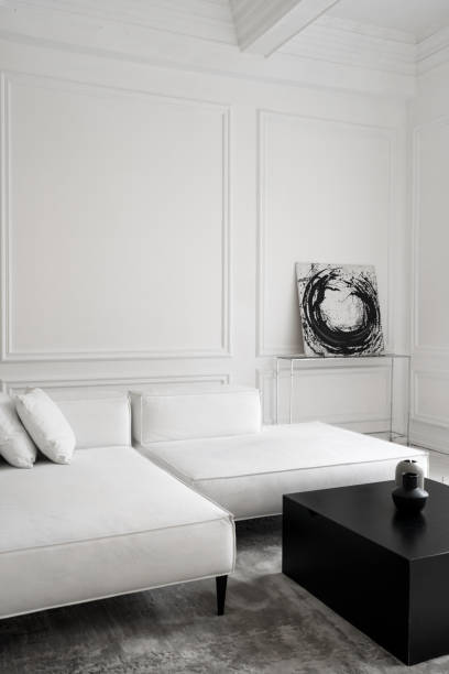 istock Stylish sofa with black table in luxury room 1320321047